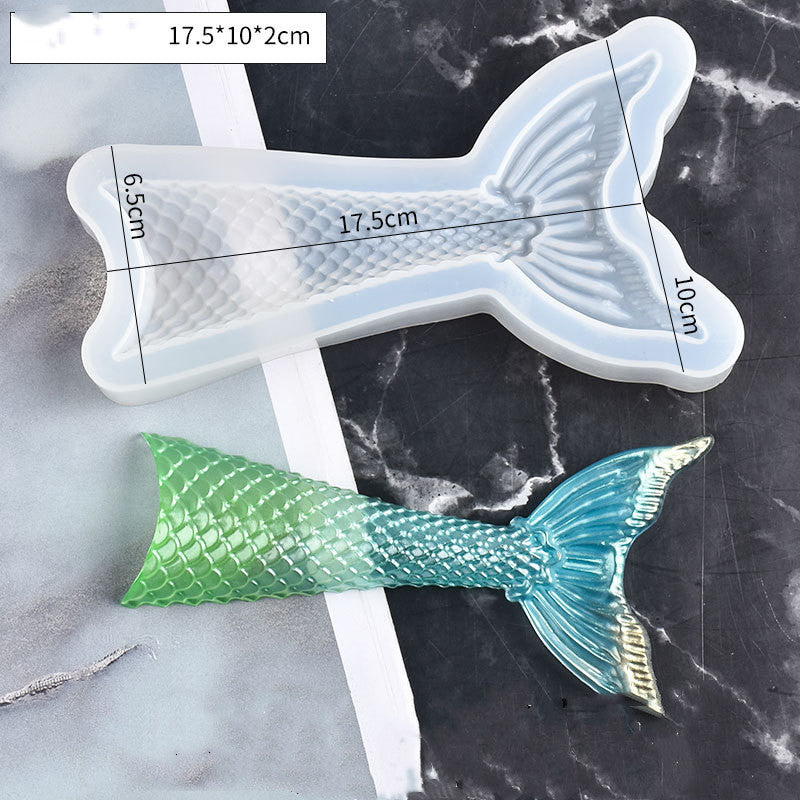 Arts And More tail silicone mold with measurements and a green and blue mermaid tail casting